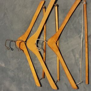 3 Wooden hangers with pant locking bar.
